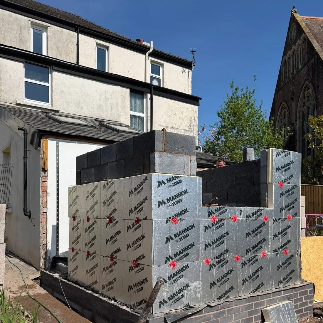 Extension mid-build with blockwork walls, before the roof goes on