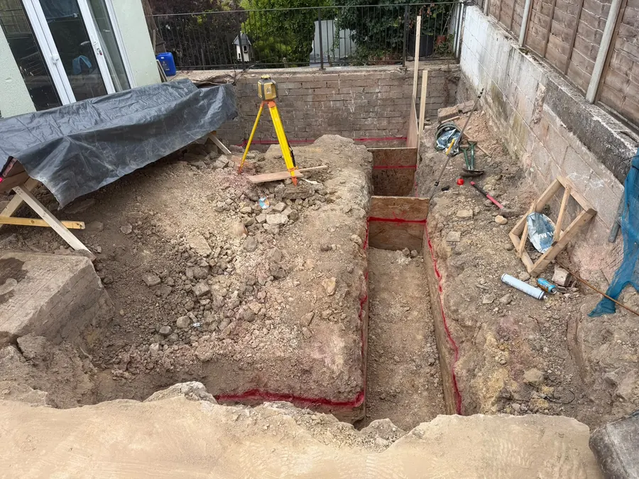 Foundation trenches dug and set out with a laser level and timber profiles