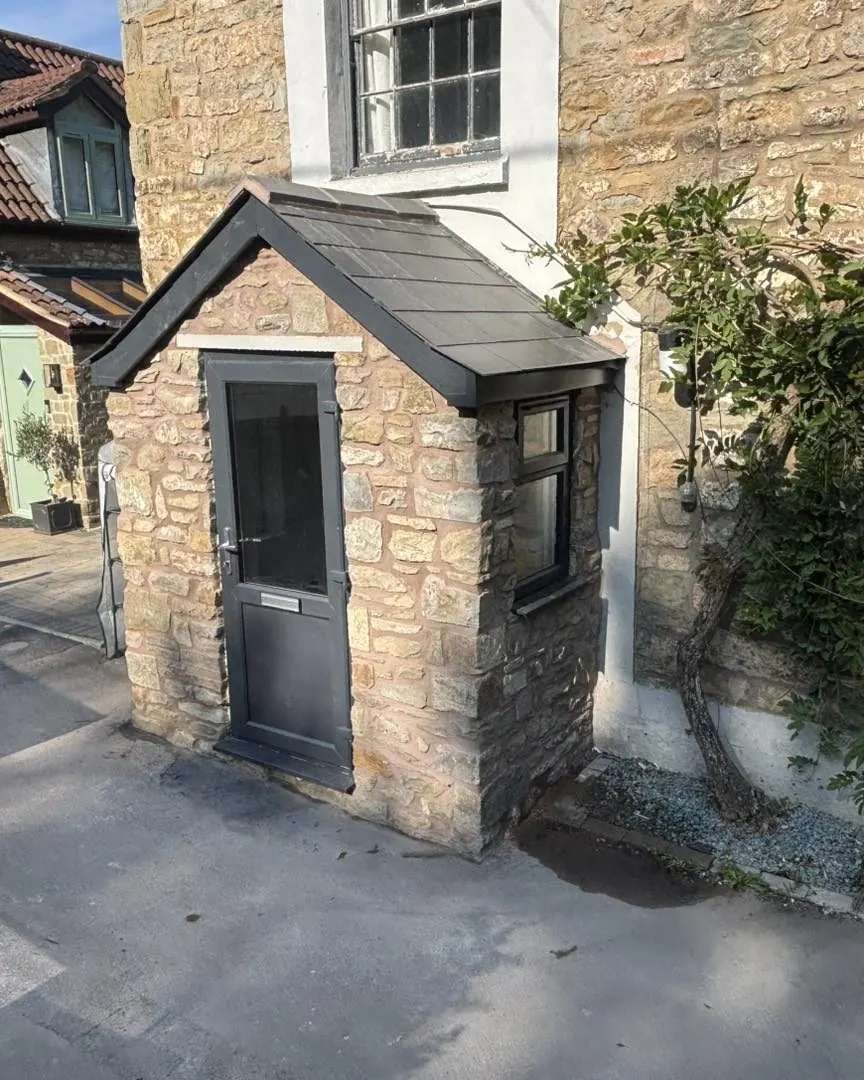 Bespoke stone porch with slate roof, finished by Smiths & Co
