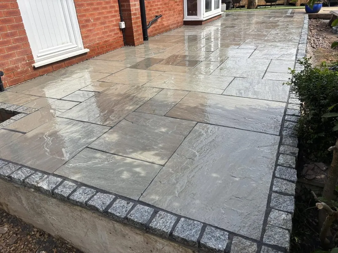Indian sandstone patio laid in a Forest of Dean garden